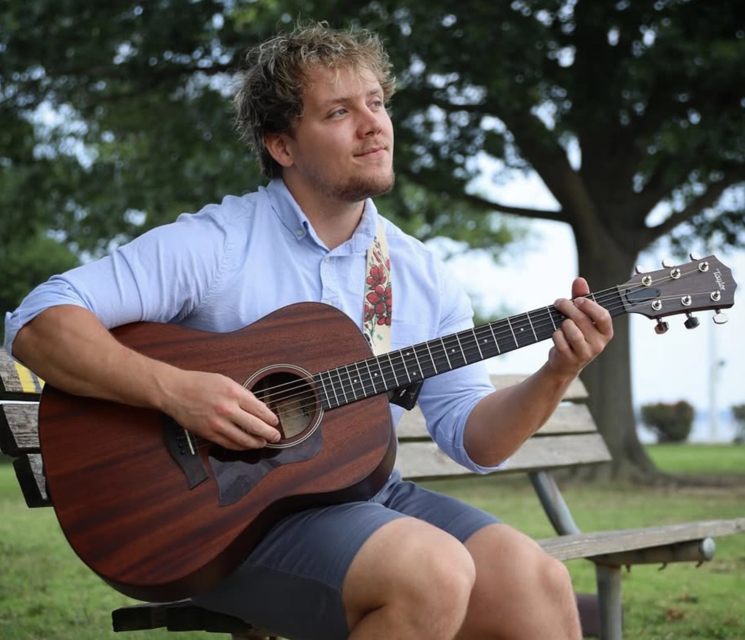 Sam Mousley playing guitar